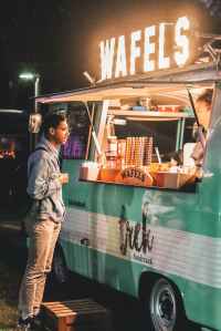 The plot revolves around two teens trying to figure out how to raise money with the old food truck his dad had.   Image: Young adult standing in front of a food truck order window: Photo by Steshka Willems on Pexels.com